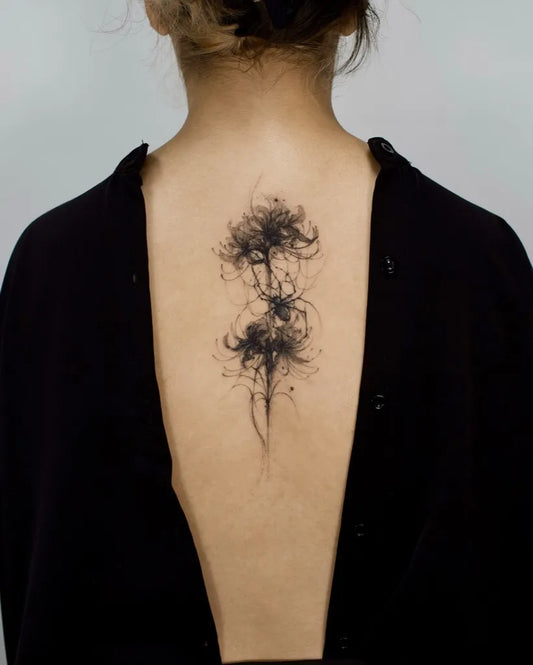 Medium Blackwork Spider Lily Tattoo on Women Back by @sansa.jr.tattoo