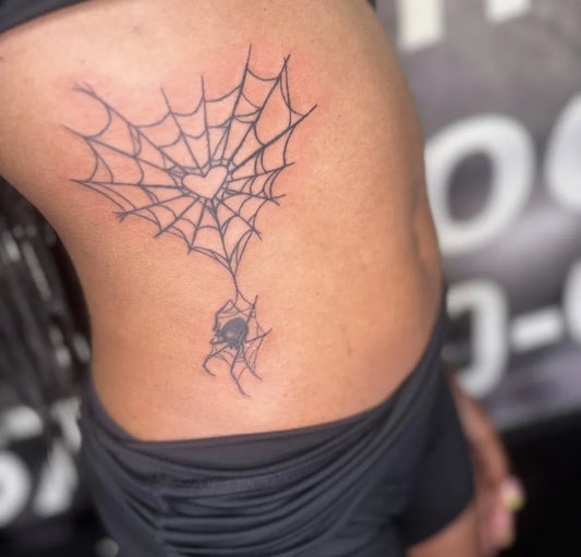 Medium Blackwork Spider Web Heart Spider on Women Hip Tattoo by @bananaarttattoos