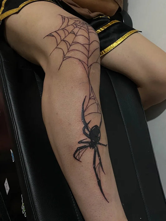 Medium Blackwork Spider Web and Spider on Women Thigh Tattoo by @nstarn_tattoo