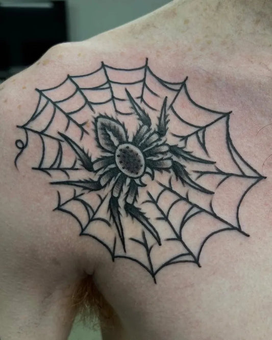 Medium Blackwork Spider and Web on Men Shoulder Tattoo by @orphicartcollective_tattoo