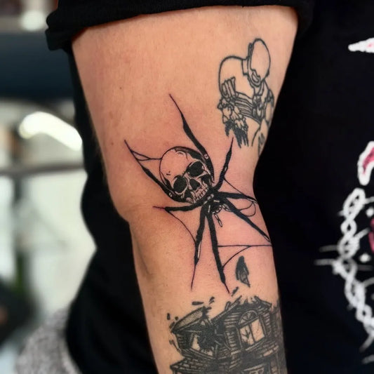 Medium Blackwork Spider with Skulls on Men Arm Tattoo by @moonbatart_