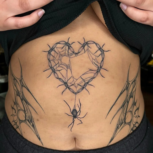 Medium Blackwork Spiderweb Heart and Spider Tattoo on Women Stomach by @venuss.inks