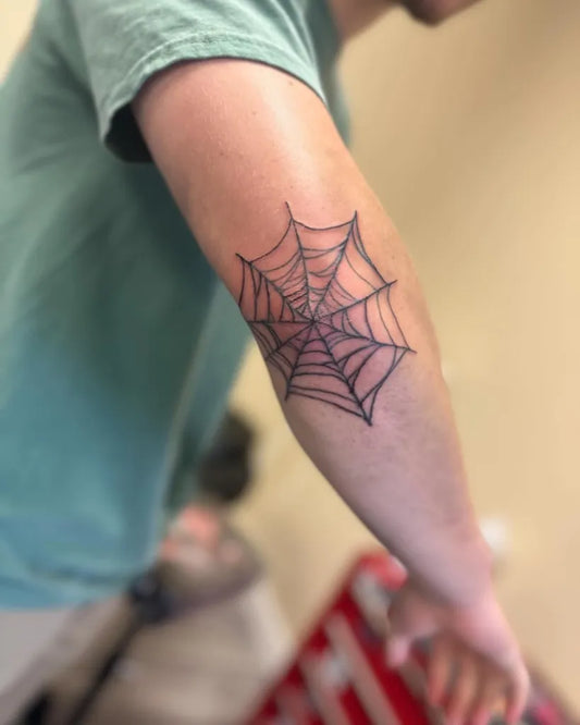 Medium Blackwork Spiderweb Tattoo on Men Elbow by @rebelrosetattoo