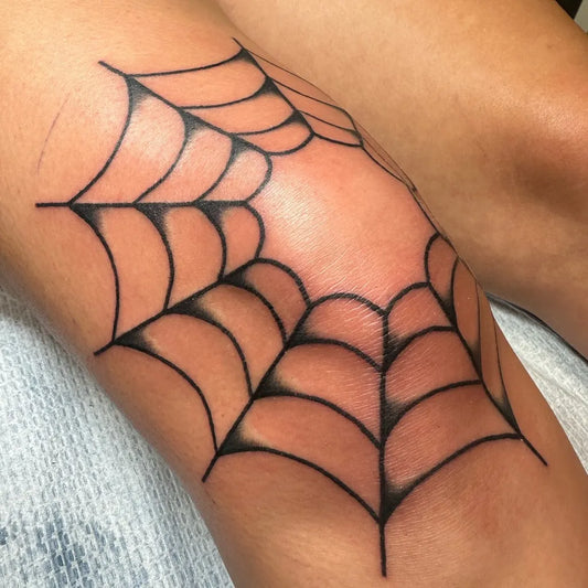 Medium Blackwork Spiderweb Tattoo on Women Knee by @jtrappetattoos