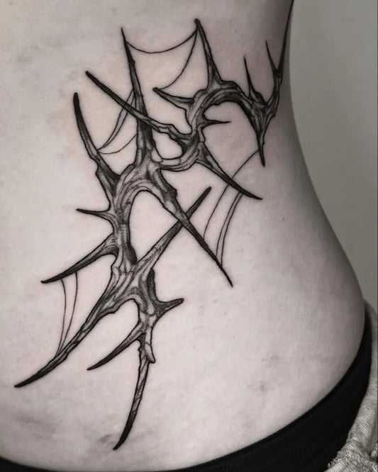 Medium Blackwork Spiky Web Tattoo on Women Rib by @spookylew.tattoo