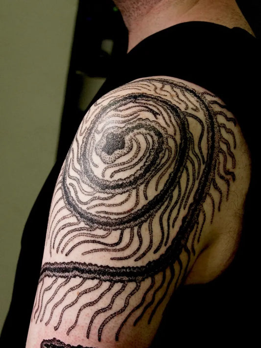 Medium Blackwork Spiral Tattoo on Men Shoulder by @feelings_boi