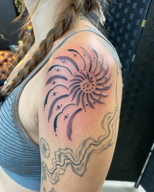Medium Blackwork SpiralTattoo on Women Shoulder by @minatattoos