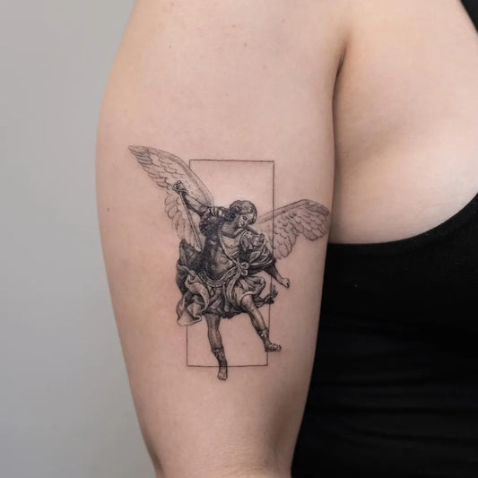 Medium Blackwork St Michael and Wings Tattoo on Women Upper Arm by @tattoosbytri