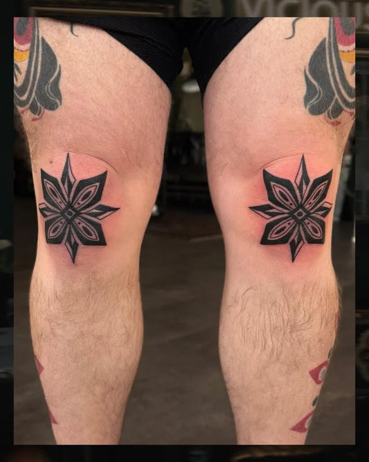 Medium Blackwork Star Tattoo on Men Knee by @s.q.u.i.d.vicious