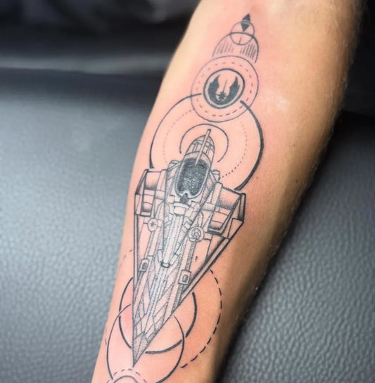 Medium Blackwork Star Wars X Wing Tattoo on Men Forearm by @tintifax.tattoo