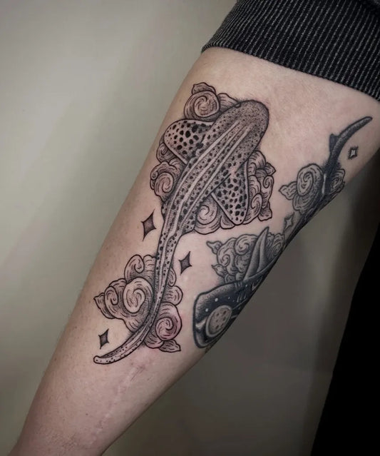 Medium Blackwork Stingray with Clouds and Stars on Women Arm Tattoo by @deaddottytattoo