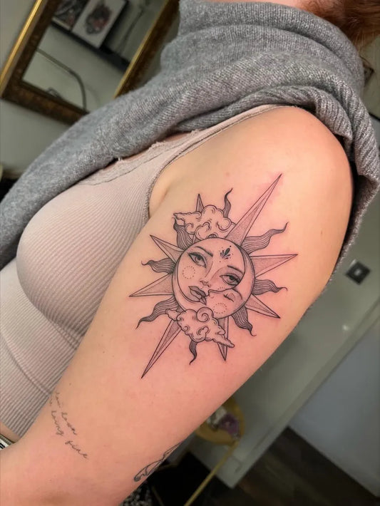 Medium Blackwork Sun Moon Faces on Women Upper Arm Tattoo by @jessicapaigetattoos