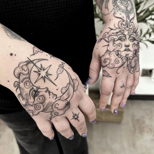 Medium Blackwork Sun and Moon and Clouds on Women Hands Tattoo by @bethanygeorgiatattoo