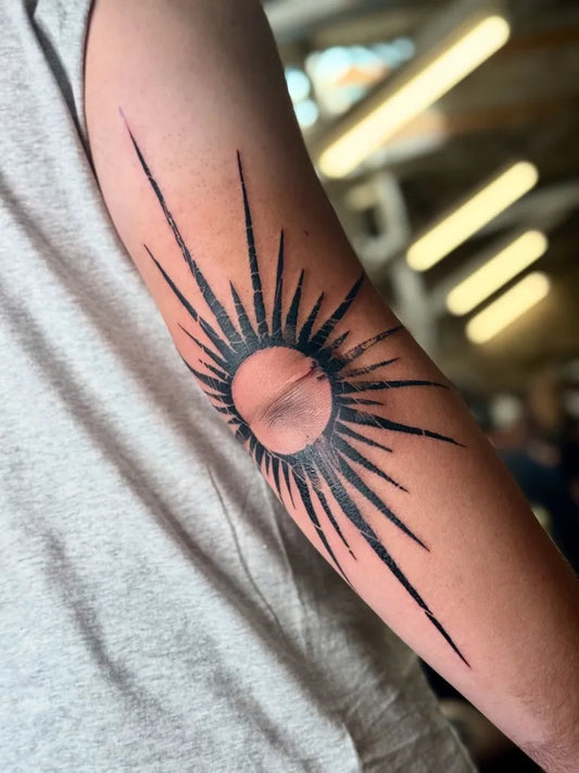 Medium Blackwork Sun on Women Arm Tattoo by @rsty_tattoos