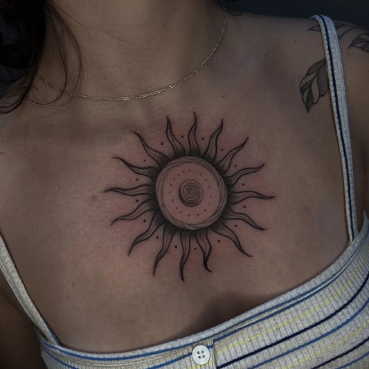 Medium Blackwork Sun on Women Chest Tattoo by @pedro.tattooer