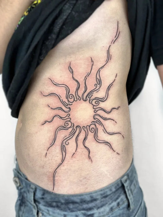 Medium Blackwork Sun on Women Ribs Tattoo by @empress.chatt