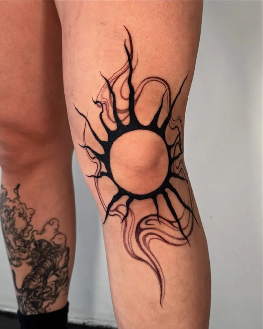 Medium Blackwork Sun with Flames on Women Knee Tattoo by @sabrinawu_tattoo