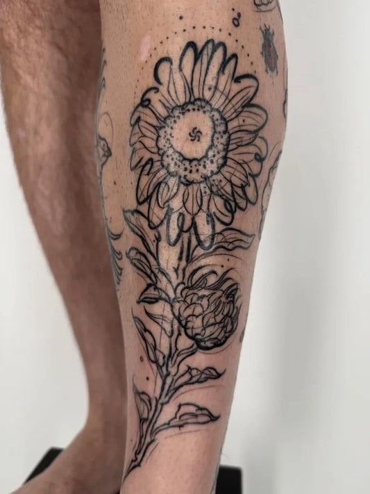 Medium Blackwork Sunflower Thistle on Men Leg Tattoo by @hannahkeuls