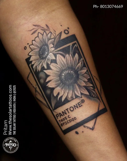 Medium Blackwork Sunflowers with Pantone Frame on Women Arm Tattoo by @the_solar_tattoo_studiokolkata