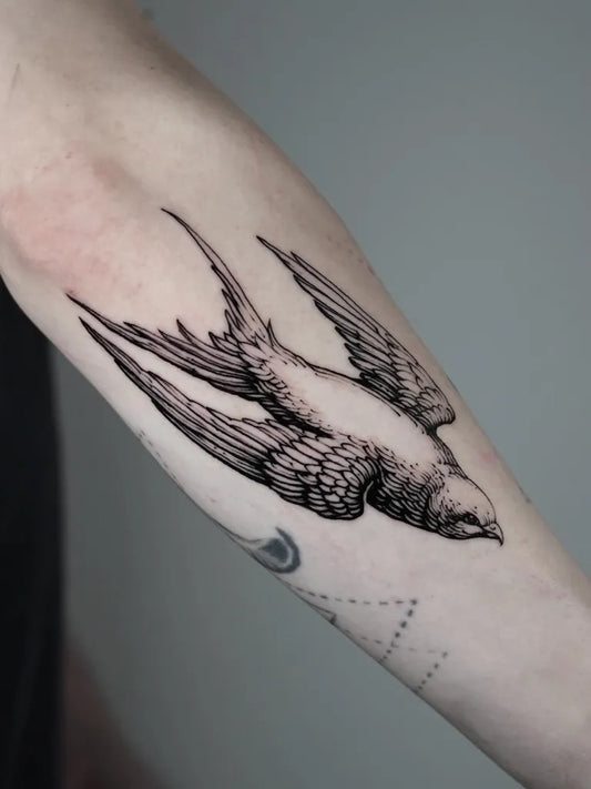 Medium Blackwork Swallow Tattoo on Men Arm by @vox.maeot