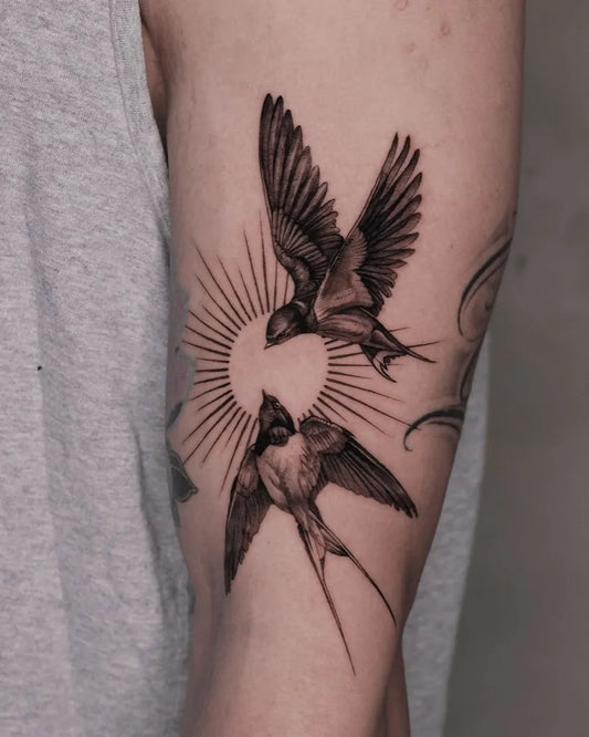 Medium Blackwork Swallow and Sun Tattoo on Men Arm by @daho_tt