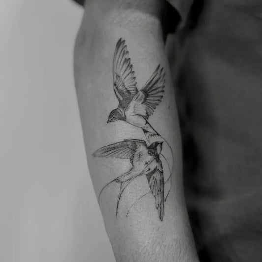 Medium Blackwork Swallows Tattoo on Men Arm by @chaurri.ink