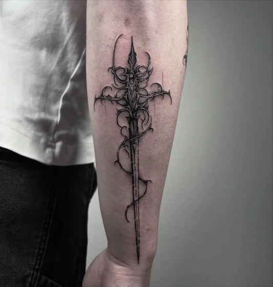 Medium Blackwork Sword Cross on Men Arm Tattoo by @brutalis.mo