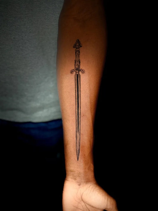 Medium Blackwork Sword on Men Arm Tattoo by @pon_ink