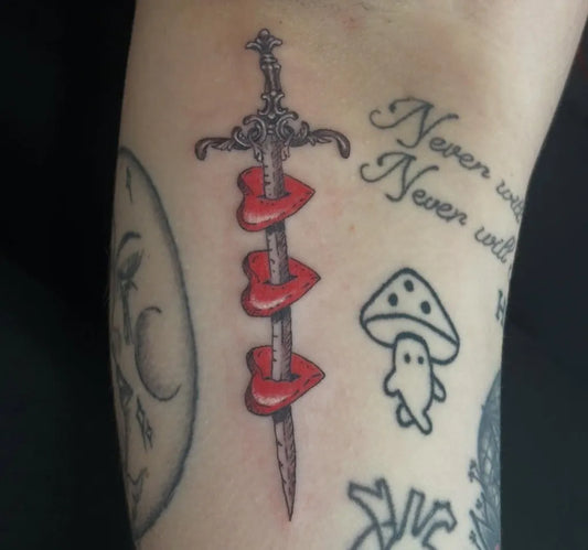 Medium Blackwork Sword with Red Hearts and Mushroom on Women Arm Tattoo by @radiantenergytattoo