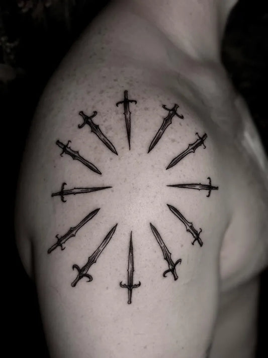 Medium Blackwork Swords Tattoo on Men Shoulder by @tarastattoos