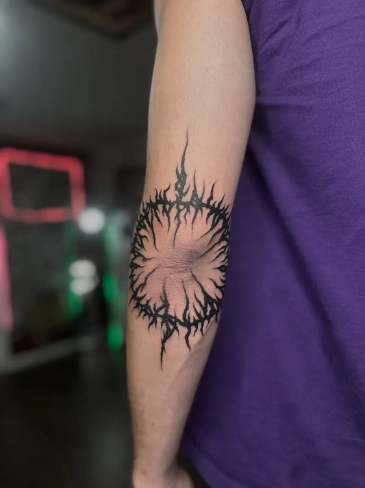 Medium Blackwork Thorny Circle Tattoo on Men Elbow by @erickforemantattoos