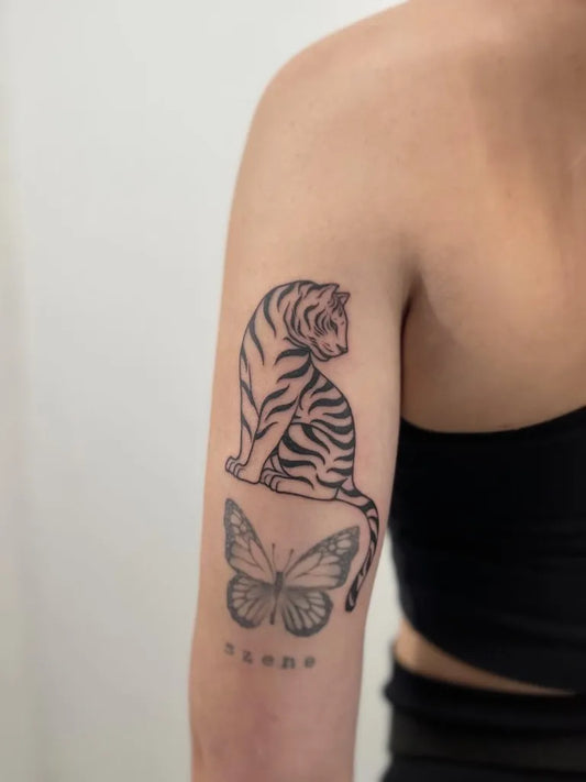Medium Blackwork Tiger and Butterfly on Women Arm Tattoo by @hongdae_tattoo_korea