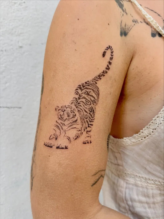 Medium Blackwork Tiger on Women Arm Tattoo by @pickn.stoketattoos