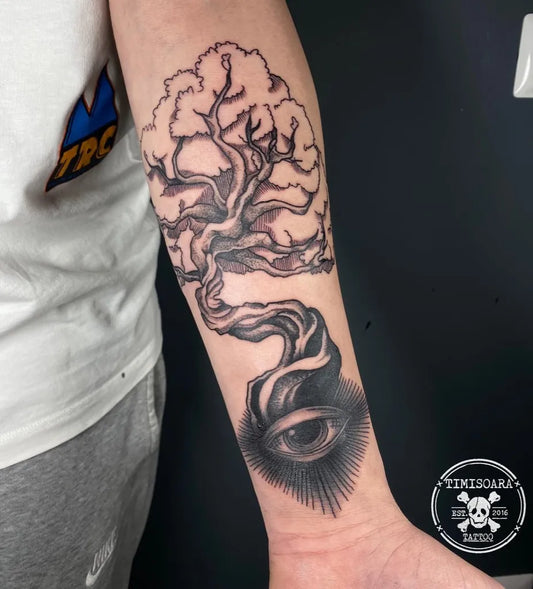 Medium Blackwork Tree and Eye Tattoo on Men Arm by @timisoara.tattoo