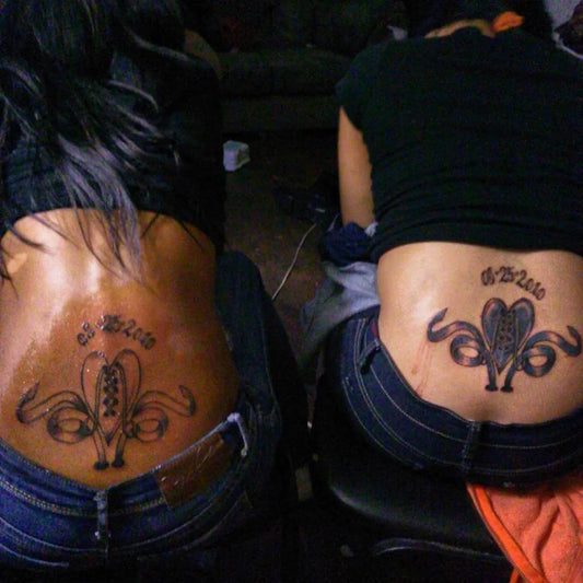 Medium Blackwork Tribal Heart Tattoo on Women Lower Back by @inky_jonballsoharddough