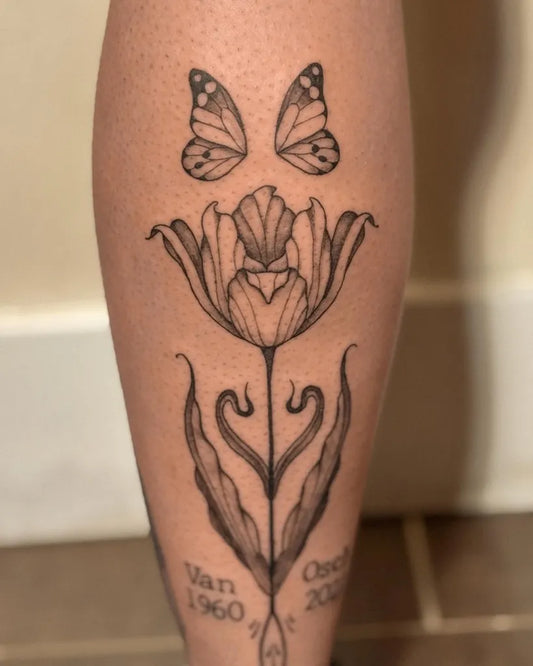 Medium Blackwork Tulip and Butterflies Tattoo on Women Leg by @pauline.tattoo
