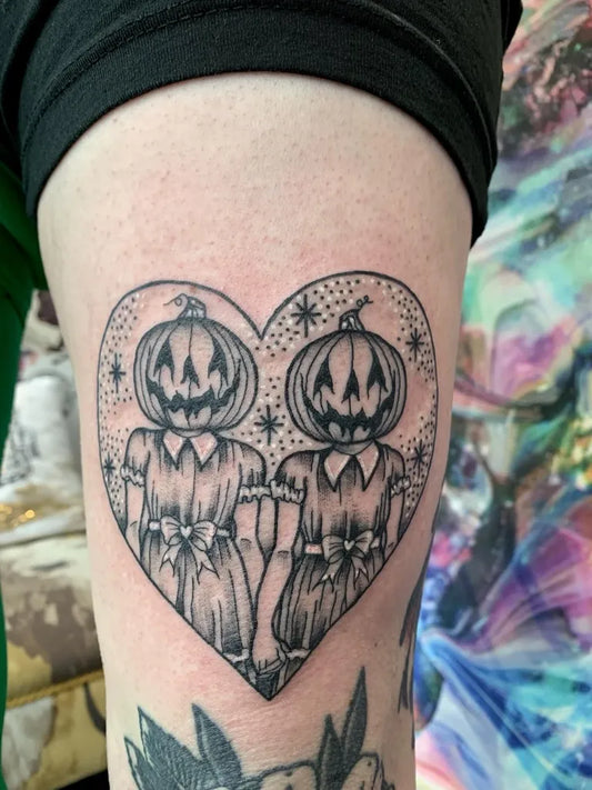 Medium Blackwork Twin Pumpkins Heart Halloween Tattoo on Women Thigh by @chelleeddytattoo