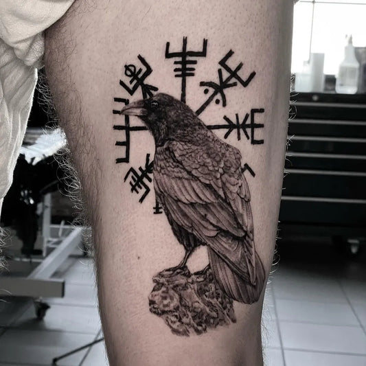 Medium Blackwork Vegvisir and Raven Tattoo on Men Thigh by @mechainktattoostudio