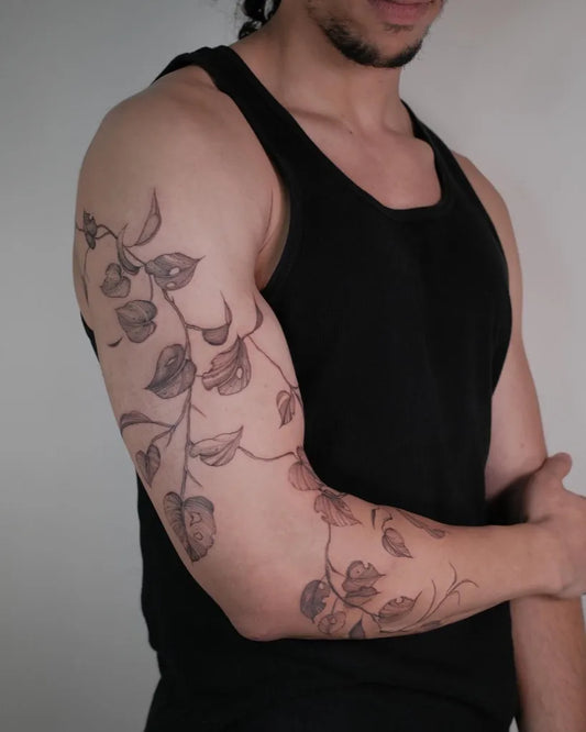 Medium Blackwork Vine Leaves on Men Arm Tattoo by @lorietattoos
