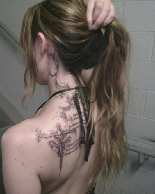 Medium Blackwork Vine Tattoo on Women Behind the Ear by @bladesinta