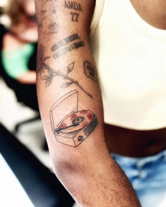 Medium Blackwork Vinyl Record Player Tattoo on Women Arm by @al.shreder