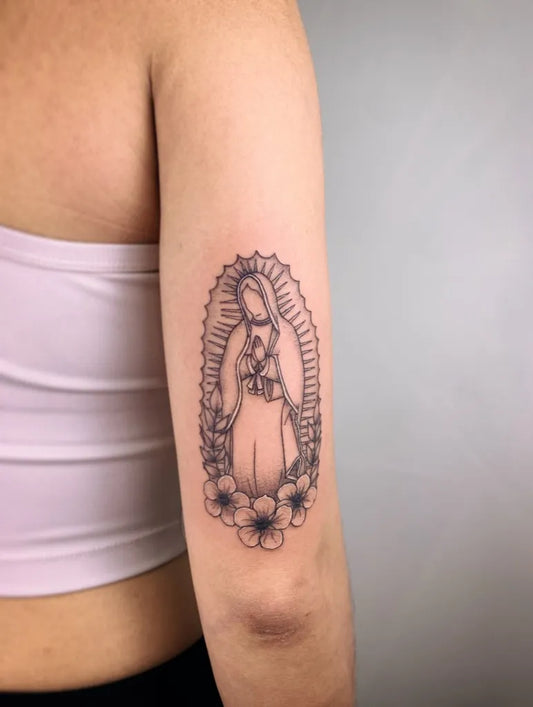 Medium Blackwork Virgin Mary Tattoo on Women Arm by @odyssey.tattoo