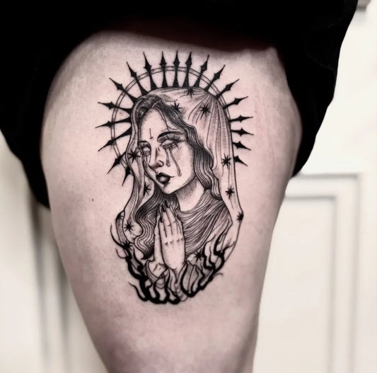 Medium Blackwork Virgin Mary with Halo and Flames Tattoo on Women Thigh by @amourtattoo