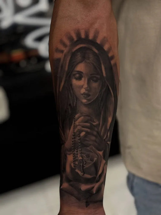 Medium Blackwork Virgin Mary with Rosary and Rose Tattoo on Men Arm by @andrew.tattooer