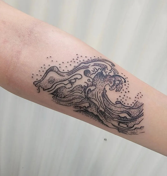 Medium Blackwork Wave Nautical Tattoo on Women Arm by @ephemeraltattoo.artists