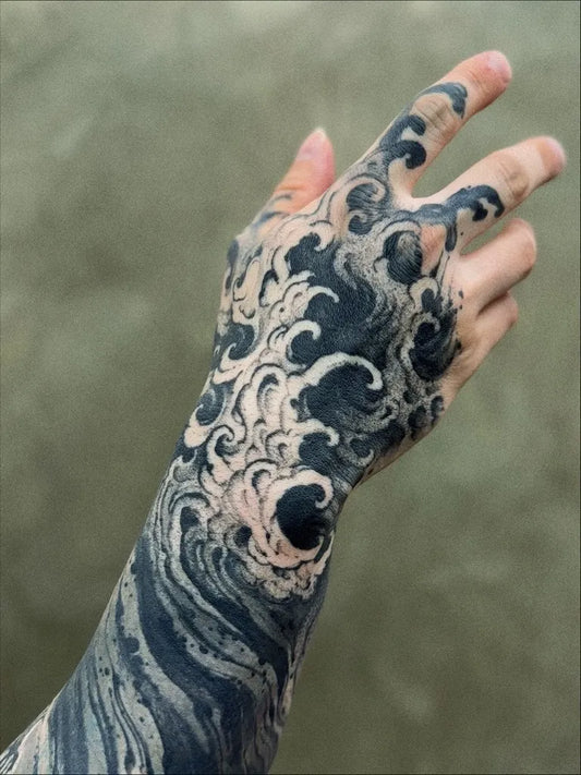 Medium Blackwork Waves Tattoo on Men Hand by @angelojolies