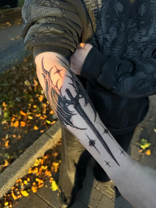 Medium Blackwork Winged Sword on Men Arm Tattoo by @mateosalinas__