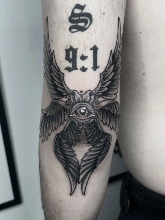 Medium Blackwork Wings Eye S Tattoo on Men Elbow by @erickforemantattoos