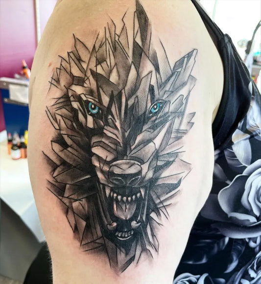 Medium Blackwork Wolf Tattoo on Women Bicep by @richwithcolor