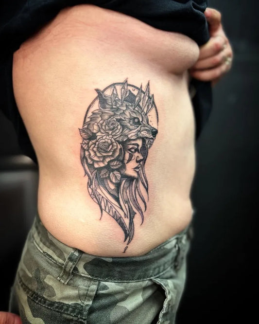 Medium Blackwork Wolf Woman Tattoo on Women Rib by @steveohtattoo